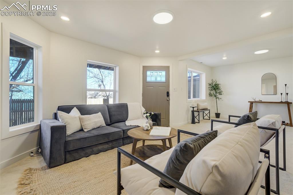 Image 22 of 35: Back door walks out to the private lower patio.