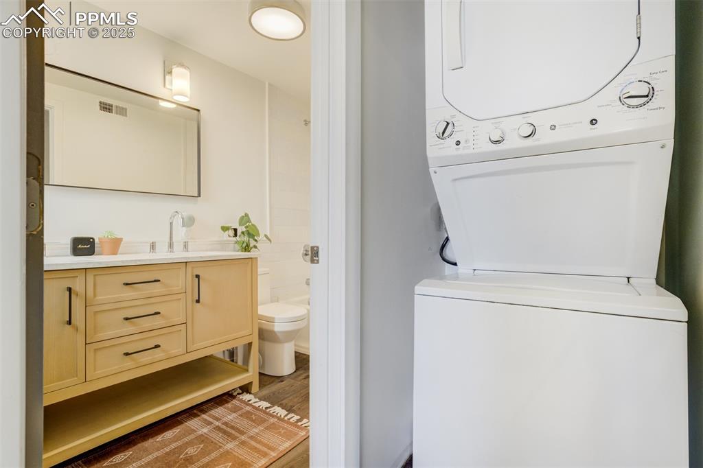 Image 27 of 35: Laundry next to the full basement bathroom.