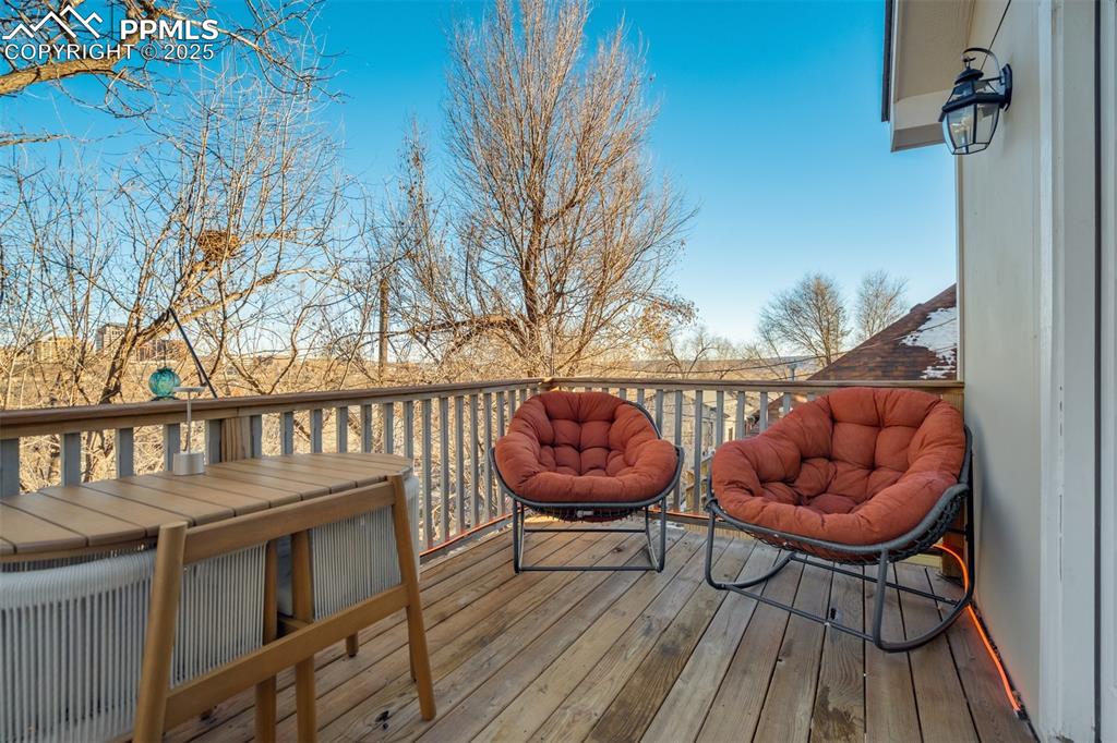 Image 30 of 35: Deck off the main level living room is the perfect space to watch a sunrise