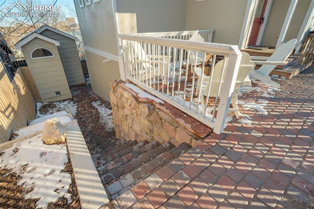 Image 32 of 35: Reinforced concrete retaining wall leads to the oversized shed!