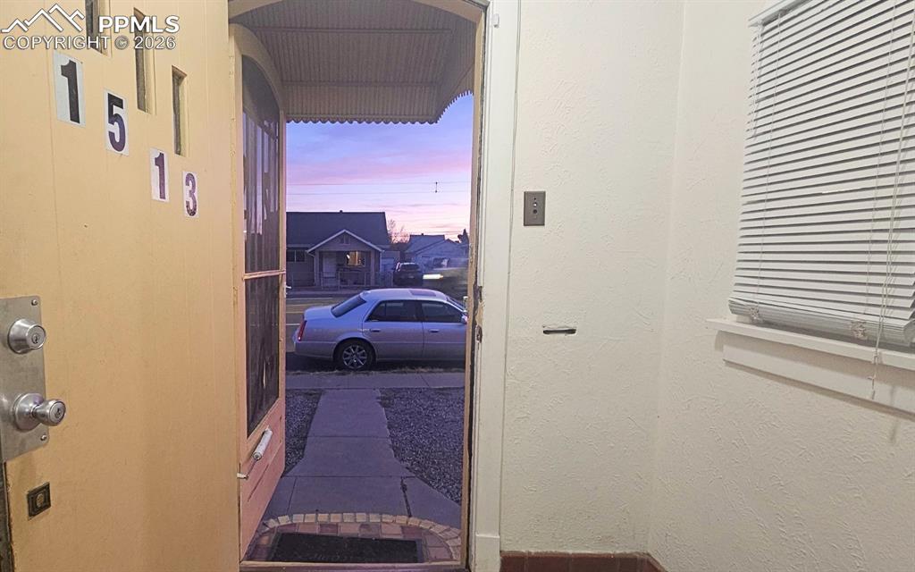 Image 28 of 28: Entryway with a Purple Hazy sky.  