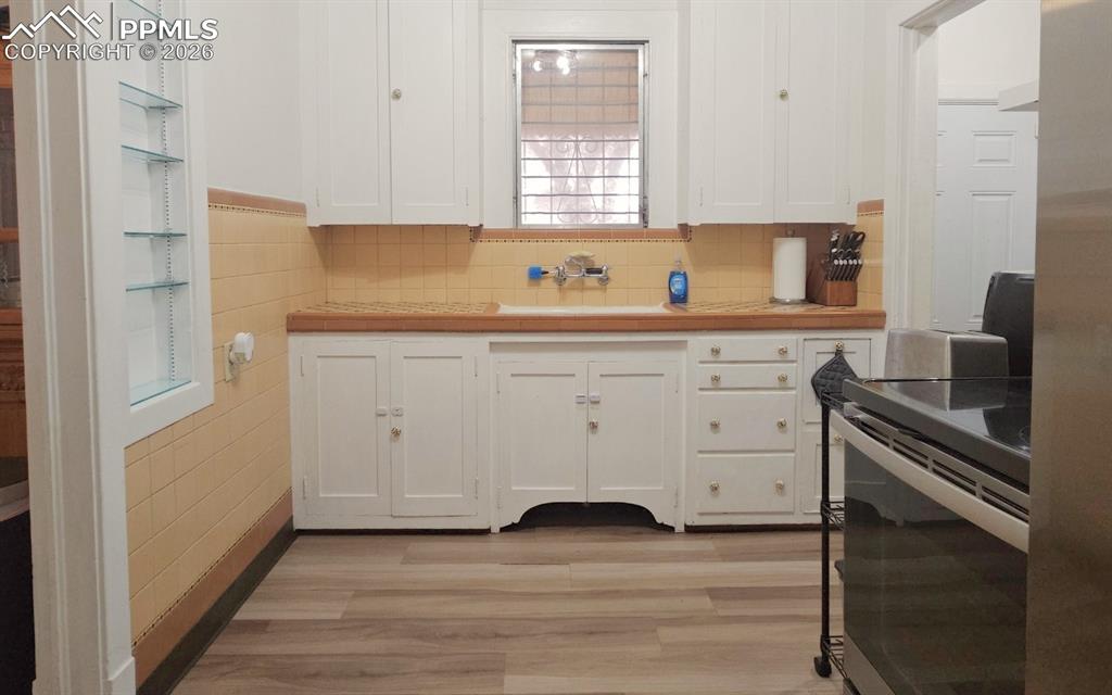 Image 9 of 28: View of Kitchen facing window.  Drop zone to the right. 