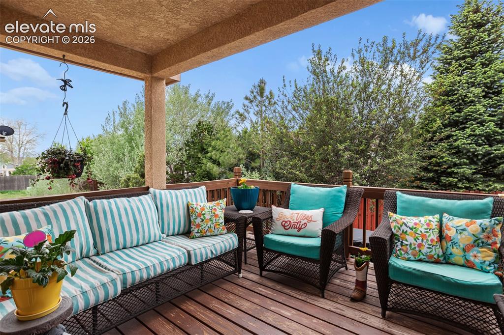 Image 3 of 25: Back deck with no homes behind you and a wall of trees