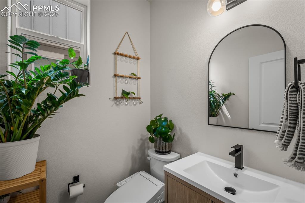 Image 20 of 49: Bathroom featuring toilet and vanity