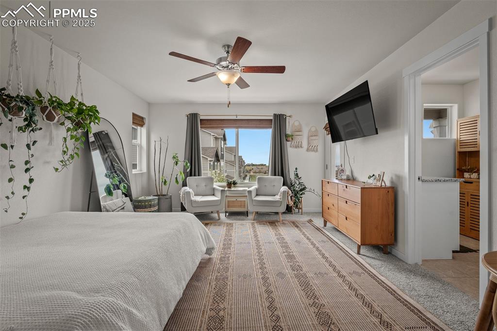 Image 25 of 49: Bedroom featuring a ceiling fan