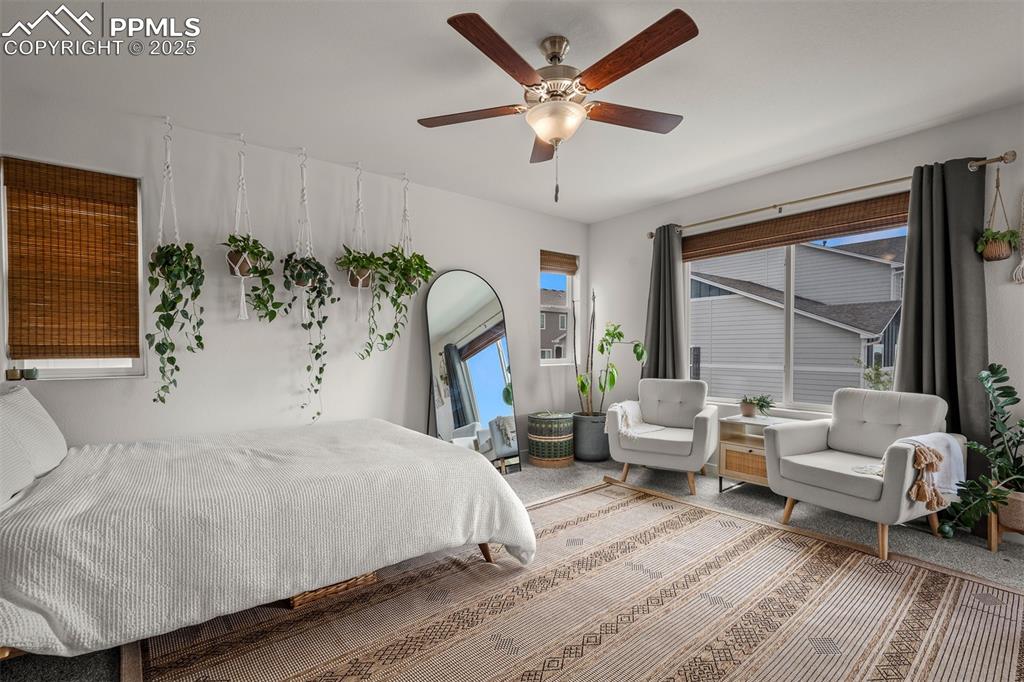 Image 27 of 49: Bedroom with a ceiling fan
