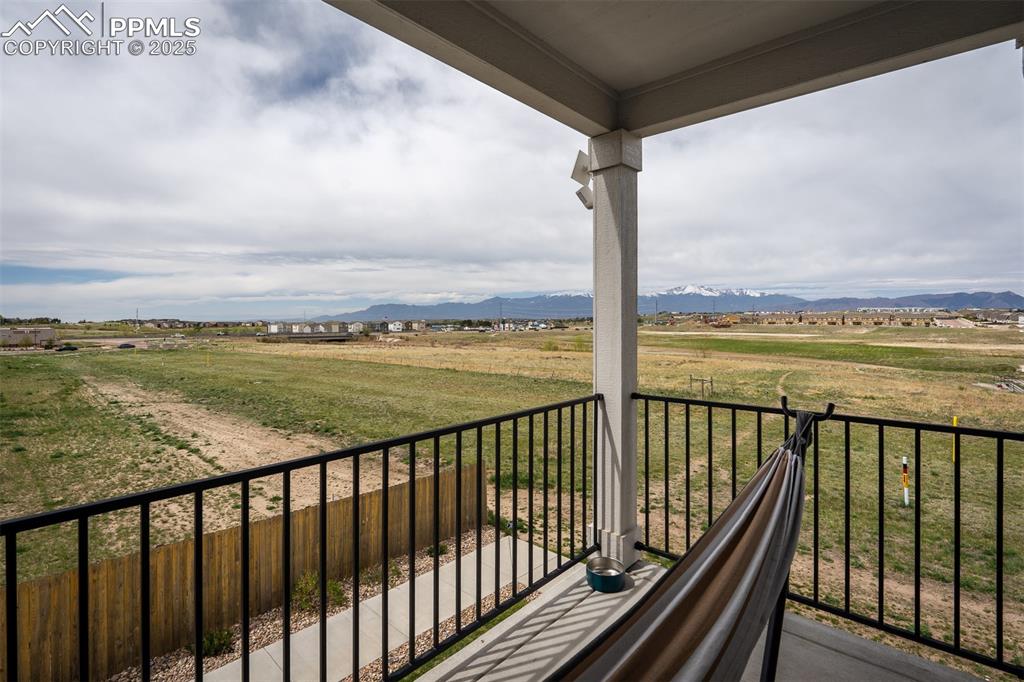 Image 28 of 49: Balcony with a view of countryside and a mountain view