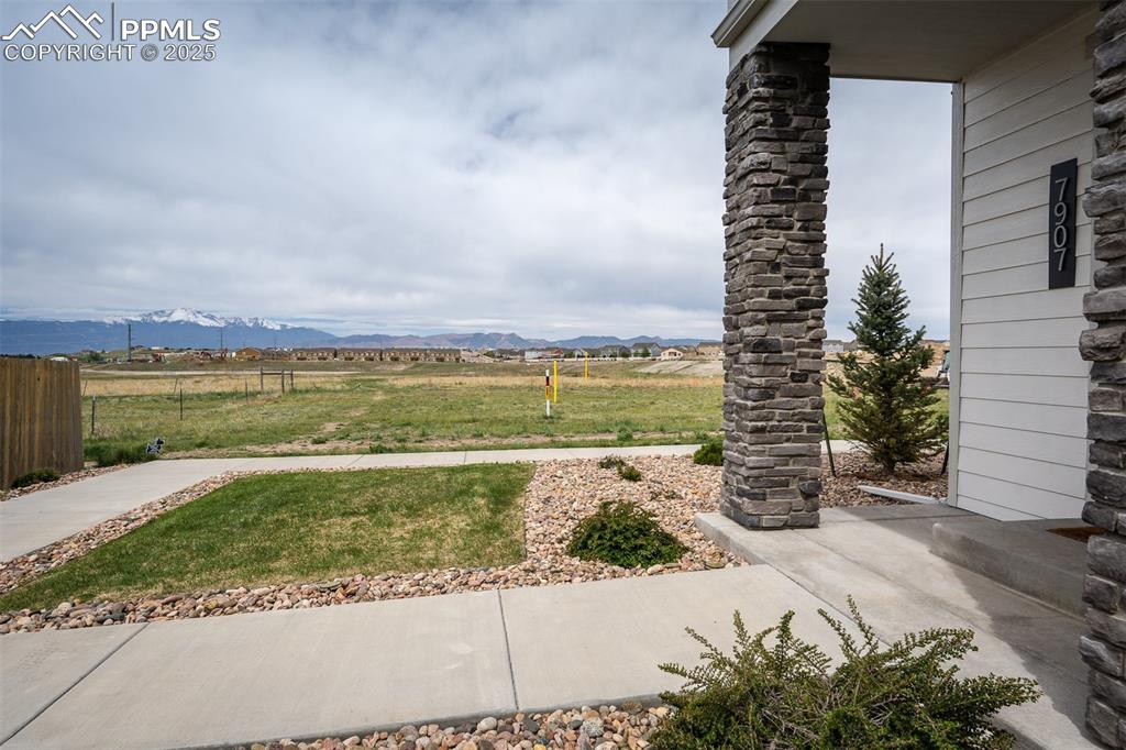 Image 5 of 49: View of yard with a mountain view