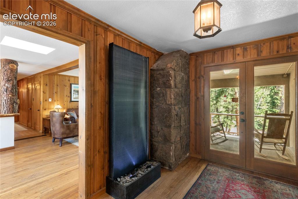 Image 12 of 50: Entrance to Porch w/ New Electrical Retractable Skylight