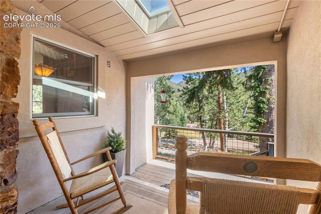 Image 13 of 50: Covered Porch w/ New Retractable Skylight