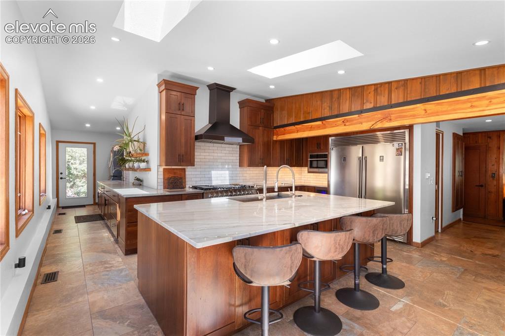 Image 21 of 50: Enormous Kitchen Island & Chef