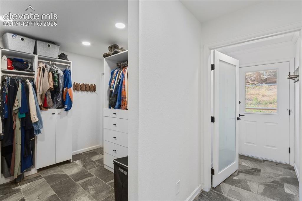 Image 35 of 50: Walk-in Closet with Washer/Dryer