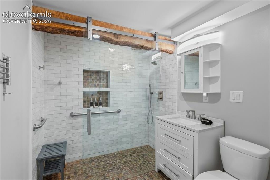 Image 43 of 50: Shared Bathroom w/ Zero-Entry Multi-functional Spa Features & Heated Floors