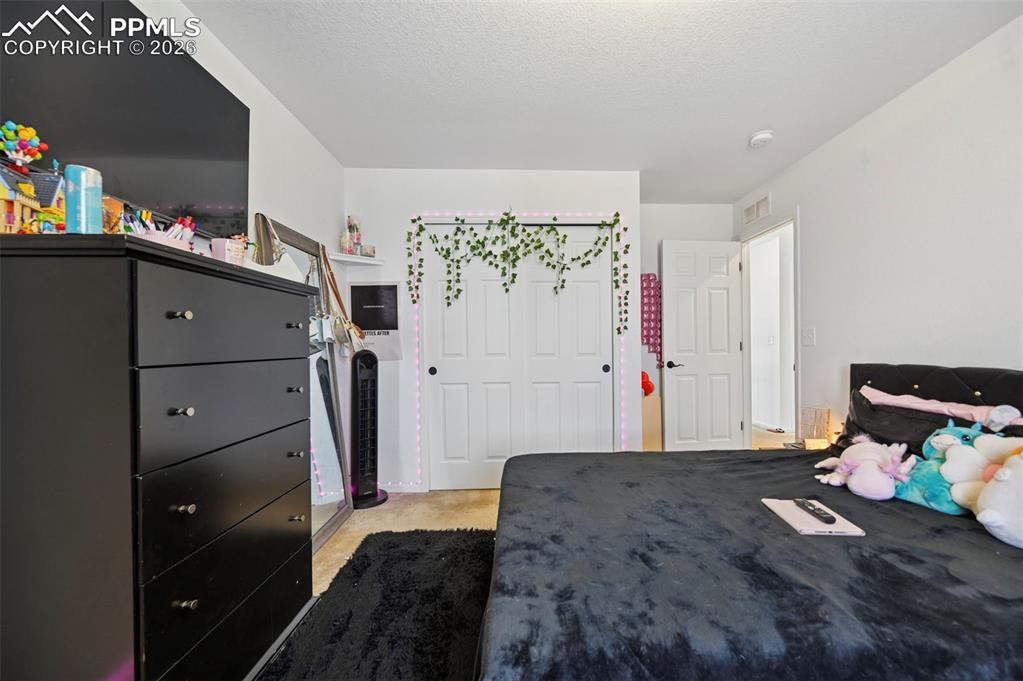 Image 16 of 43: Neutral color palette with white walls, carpet flooring, dual sliding close