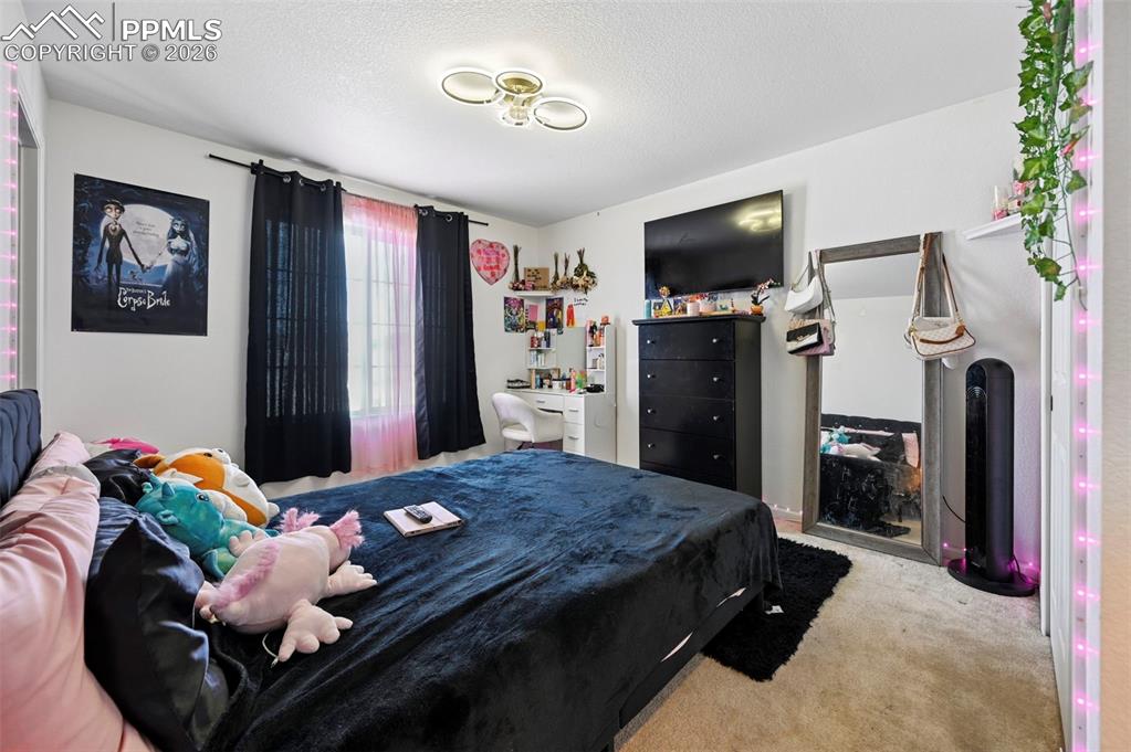 Image 19 of 43: Room featuring a window with natural light, wall-mounted television, ceilin