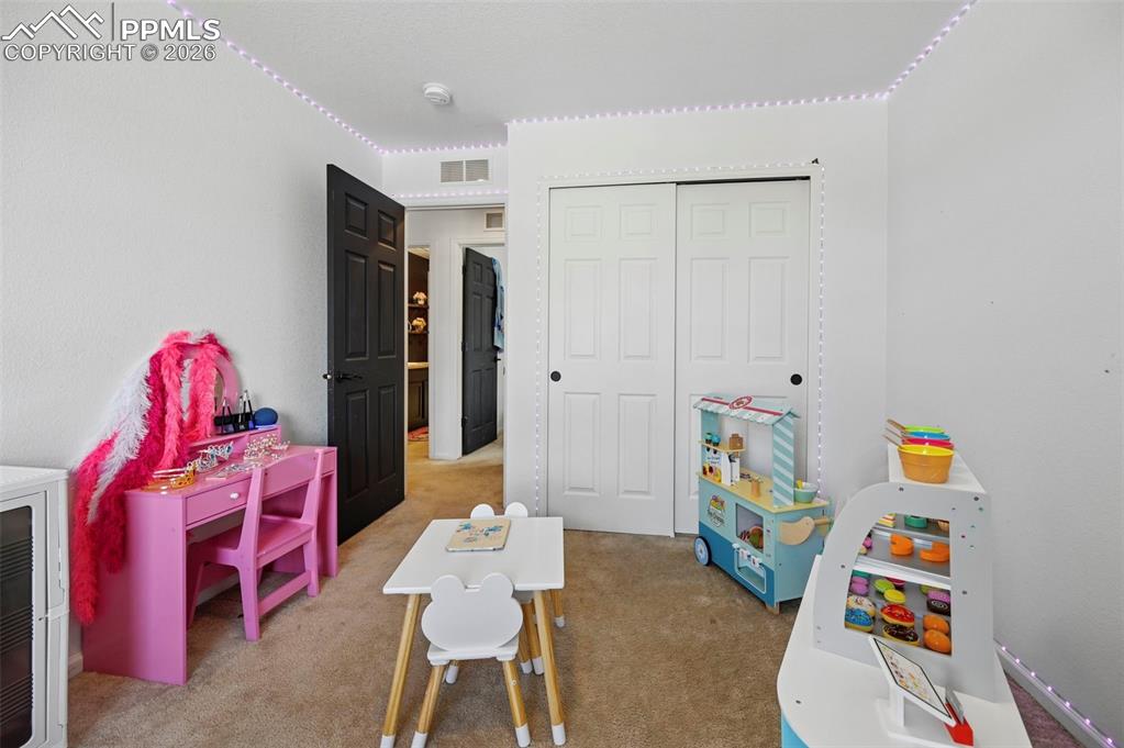 Image 20 of 43: Neutral-toned carpeting and white walls create a versatile interior