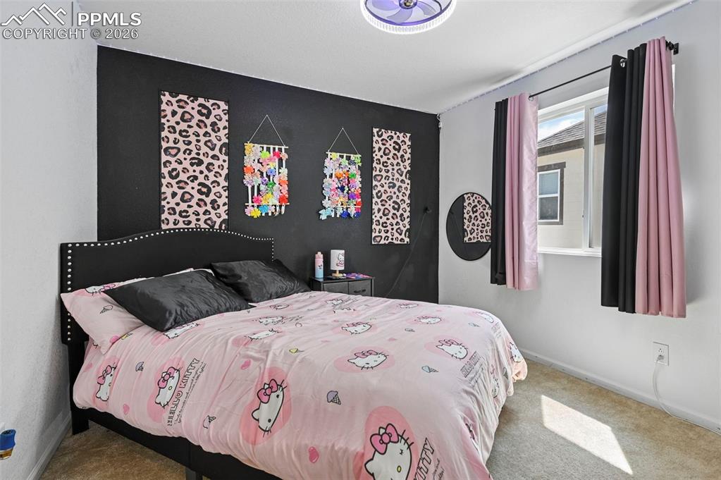 Image 28 of 43: Neutral colored carpeted flooring, a ceiling-mounted light fixture, and a w