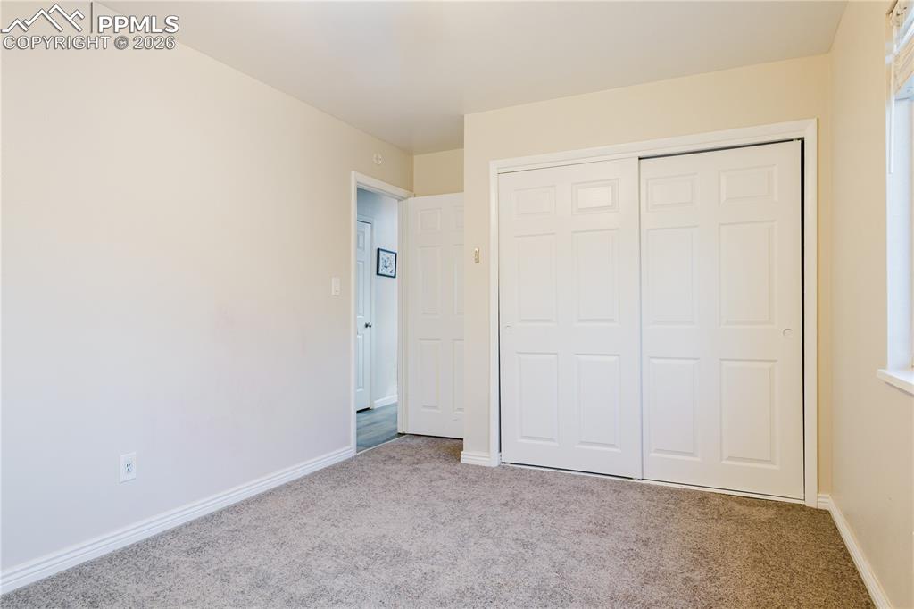 Image 12 of 20: Unfurnished bedroom featuring carpet and a closet