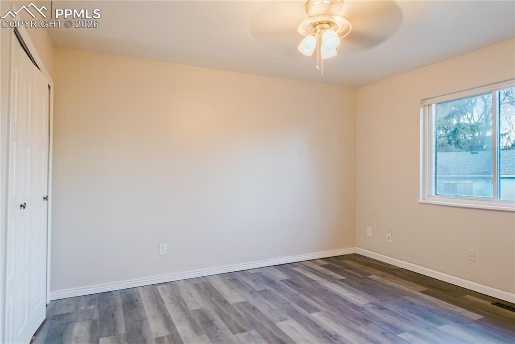 Image 13 of 20: Unfurnished bedroom featuring a closet, wood finished floors, and a ceiling