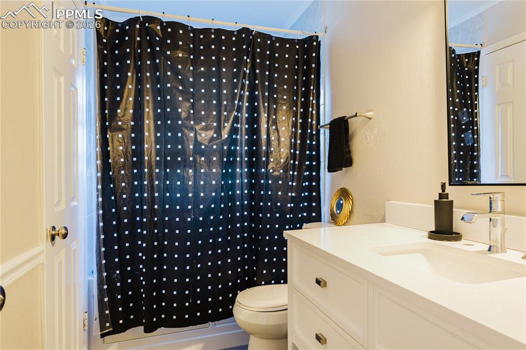 Image 2 of 20: Full bath featuring vanity and shower / bathtub combination with curtain
