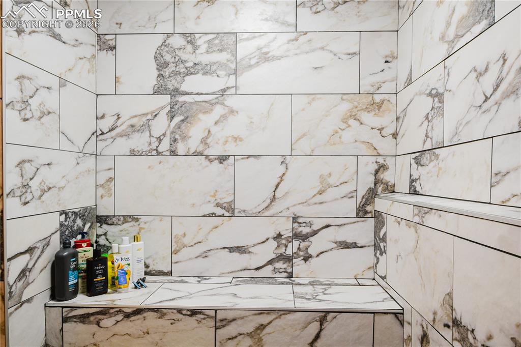 Image 8 of 20: Bathroom view of a tile shower
