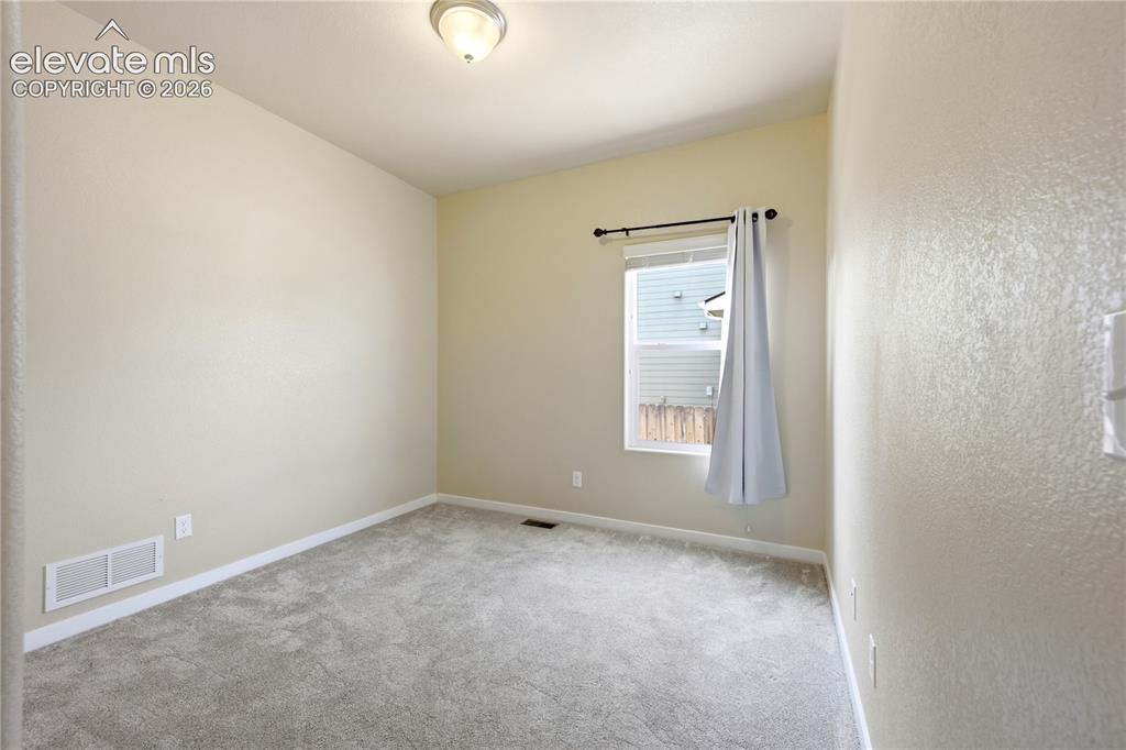 Image 25 of 46: Neutral wall finishes, recessed window, wall-to-wall carpeting, and a ceili