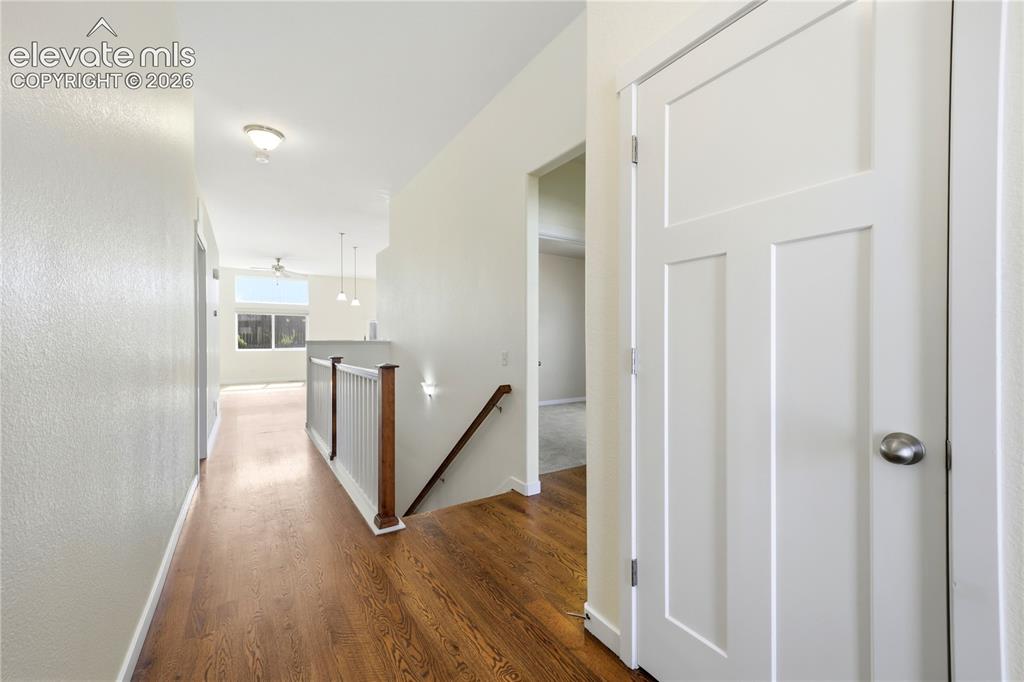 Image 4 of 46: Wood-finish flooring, stainless steel appliances, upper and lower wood cabi