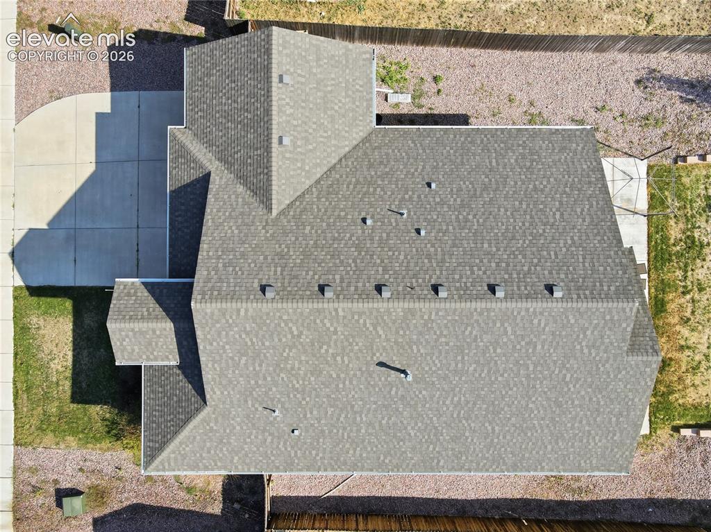 Image 41 of 46: Asphalt shingle roof with multiple gables and vents