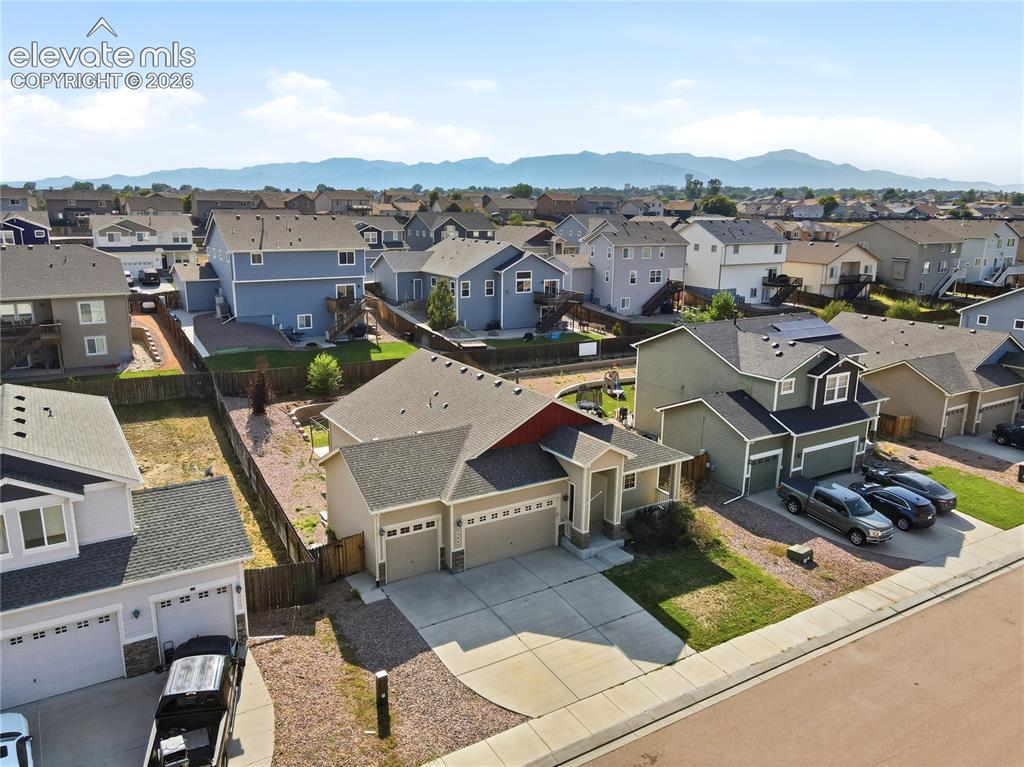 Image 44 of 46: Neighborhood setting with visible mountain backdrop