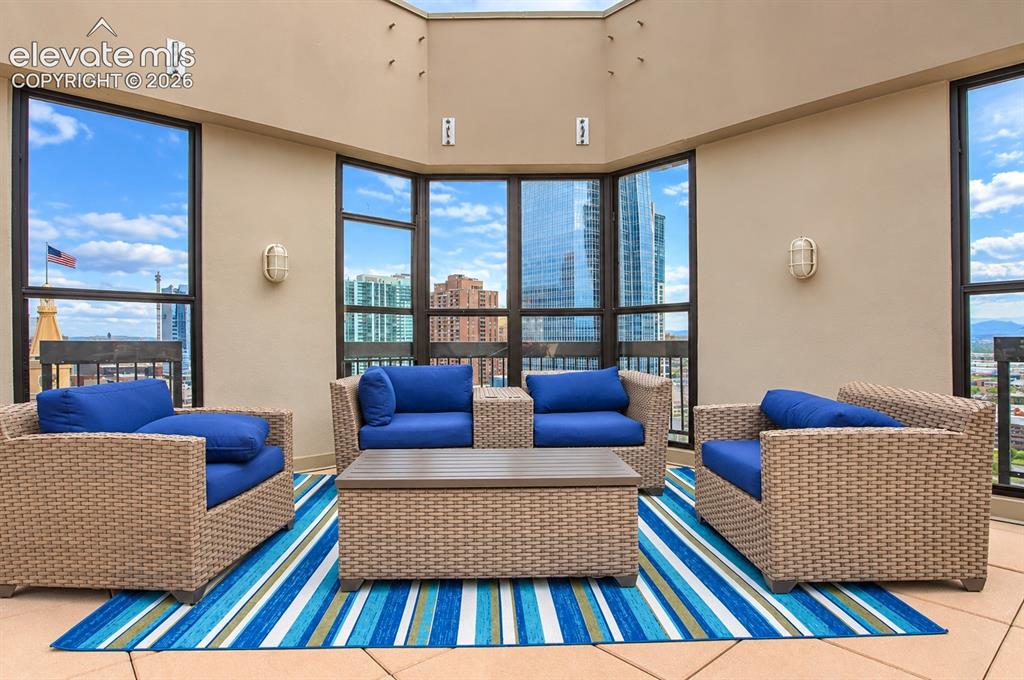 Image 25 of 35: Expansive outdoor terrace featuring multiple large windows, recessed ceilin