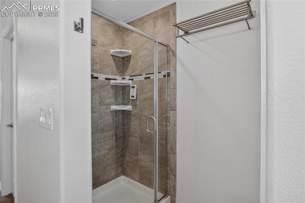 Image 13 of 26: Primary bath walk-in shower