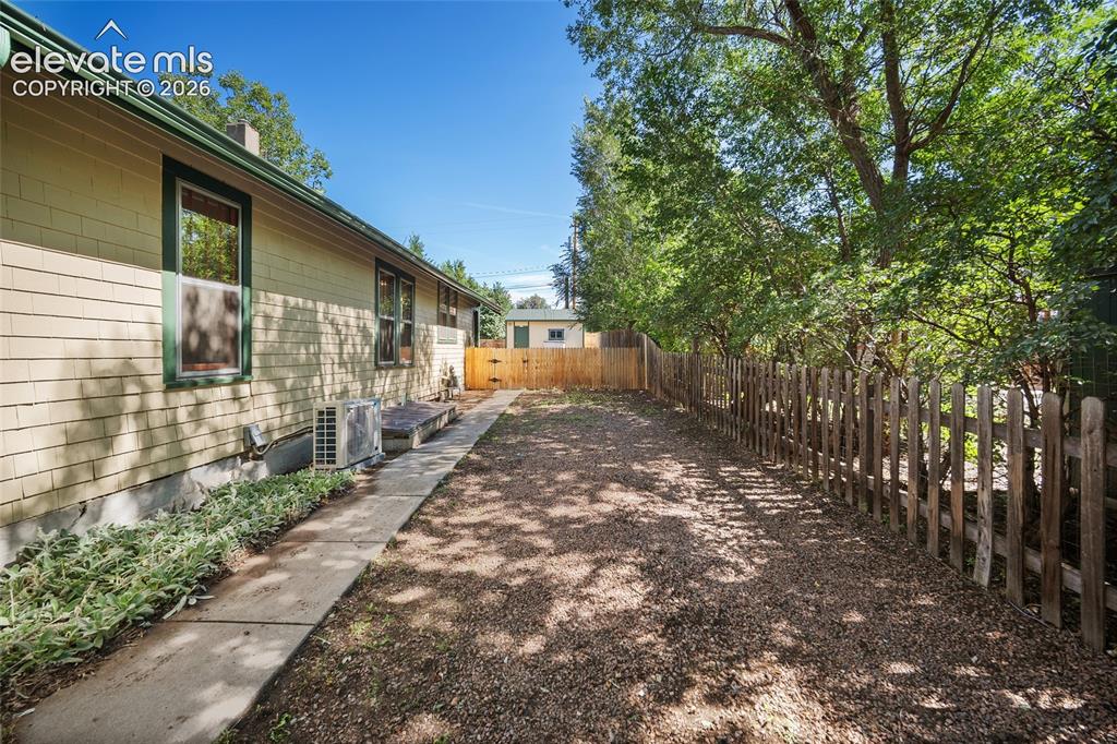 Image 29 of 32: Side yard for additional parking 