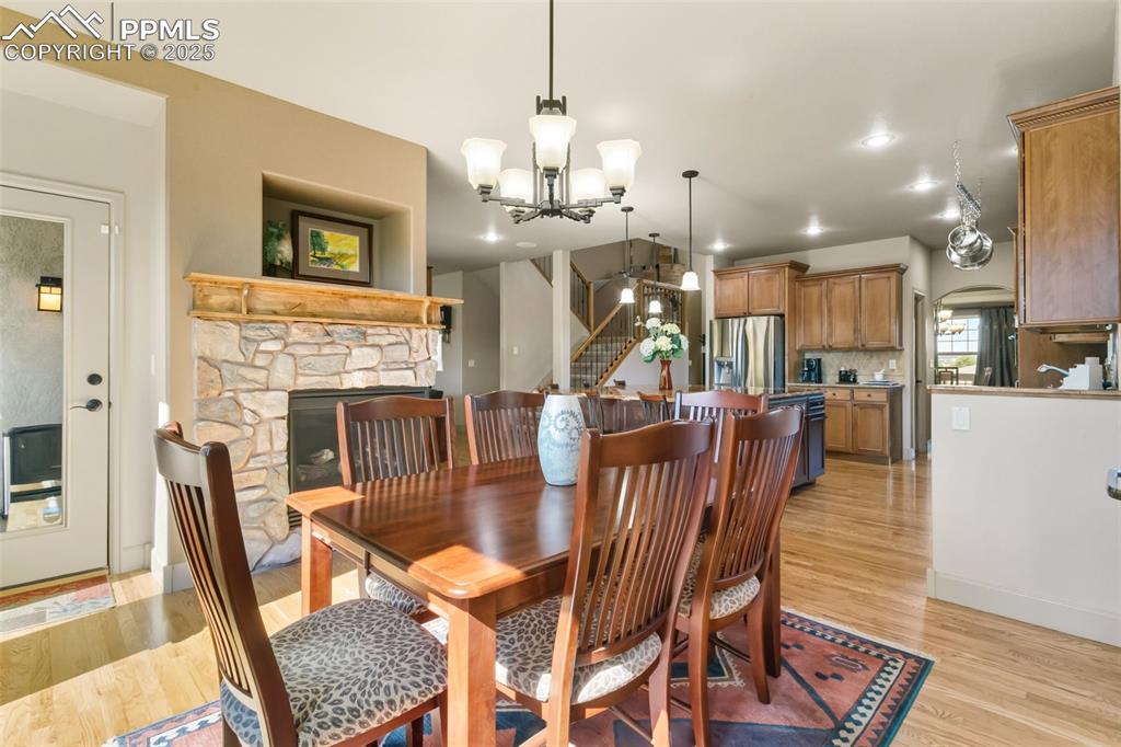 Image 15 of 50: Dining area w/double sided fireplace!