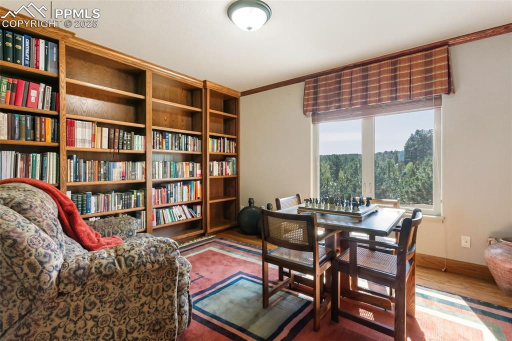 Image 28 of 50: Library w/Built-In Bookshelves.  Has a closet so could be used as a bedroom