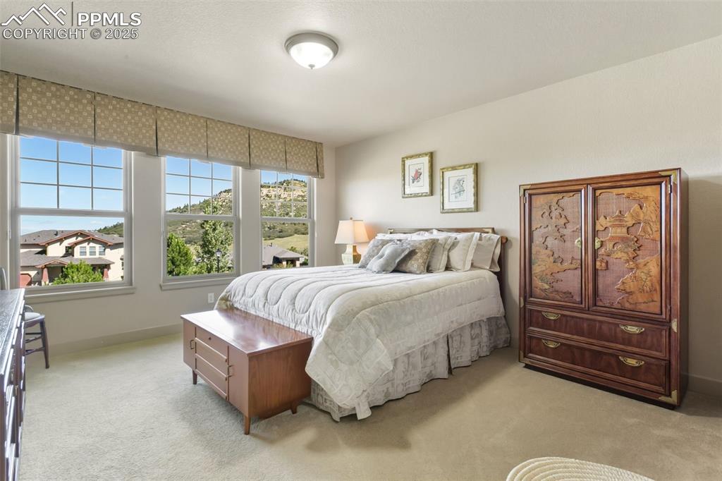 Image 30 of 50: Upper Level Bedroom