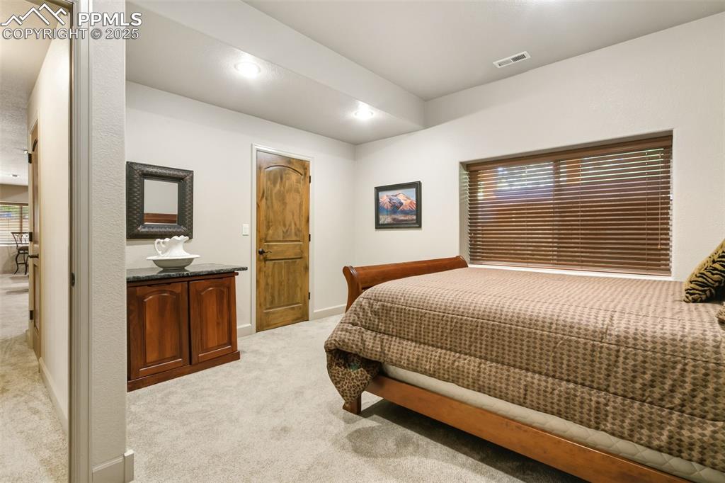 Image 38 of 50: Basement Bedroom