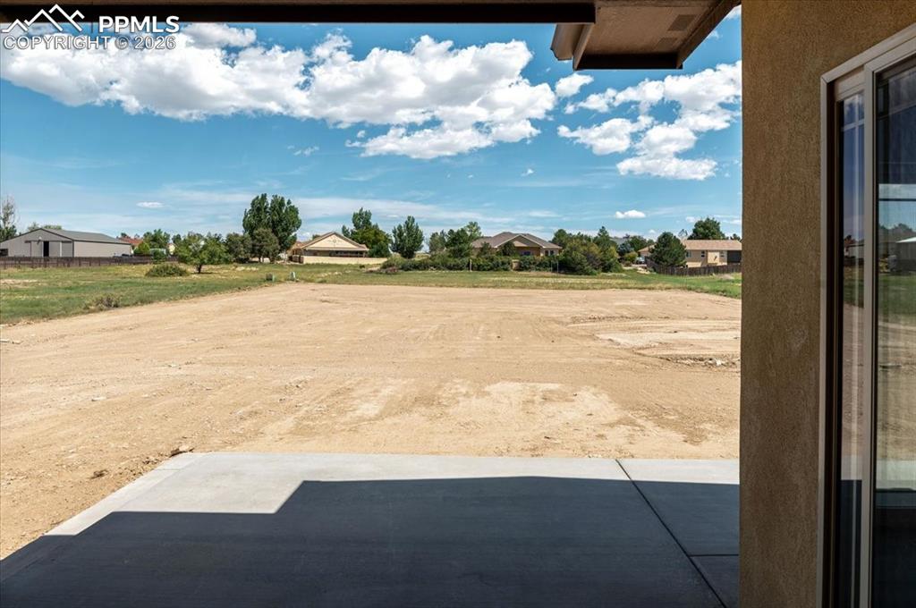 Image 30 of 40: View of yard with a patio area