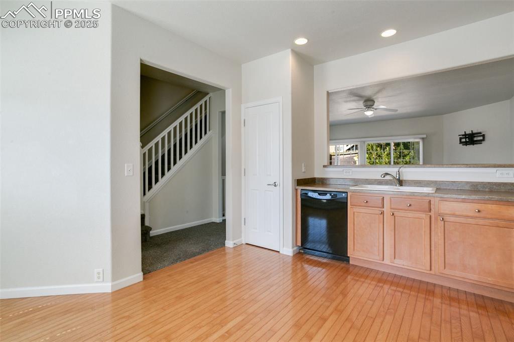 Image 11 of 28: Kitchen with dishwasher, light wood-type flooring, recessed lighting, light