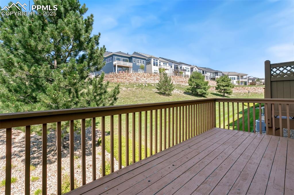 Image 27 of 28: Deck with a yard and a residential view