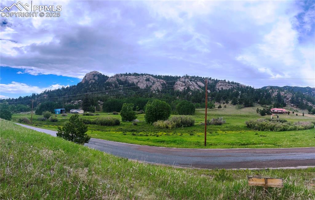 Image 6 of 19: View of rock outcroppings across road