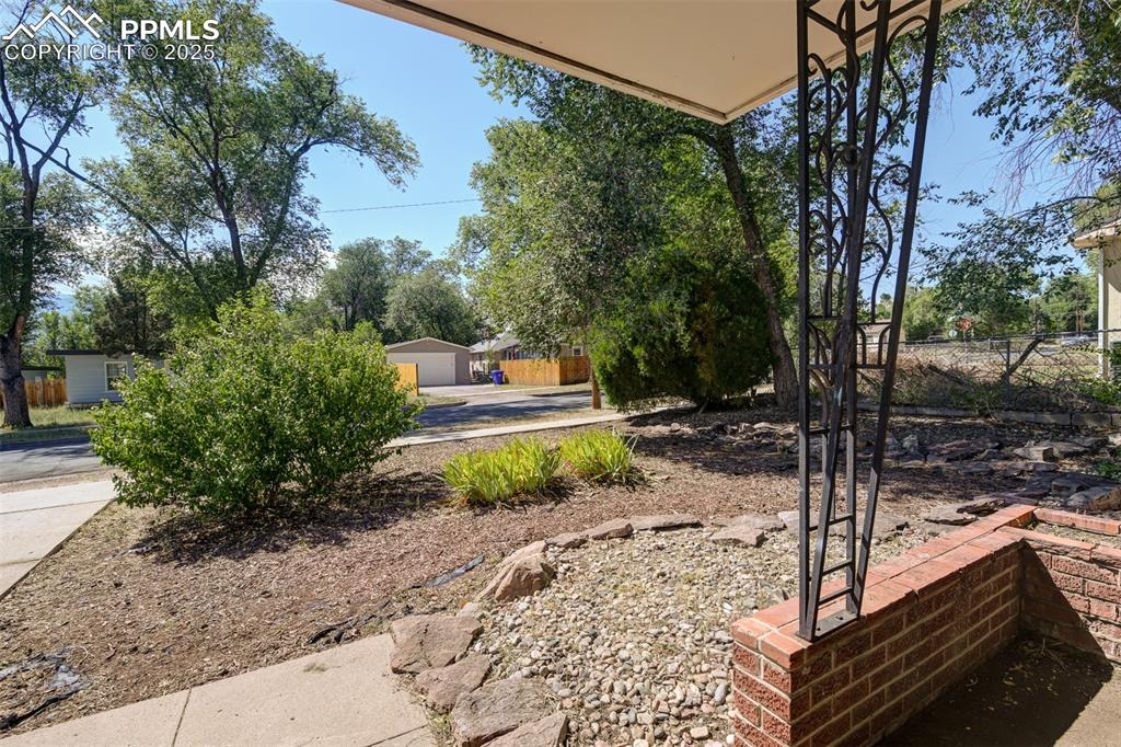 Image 4 of 23: covered front entry