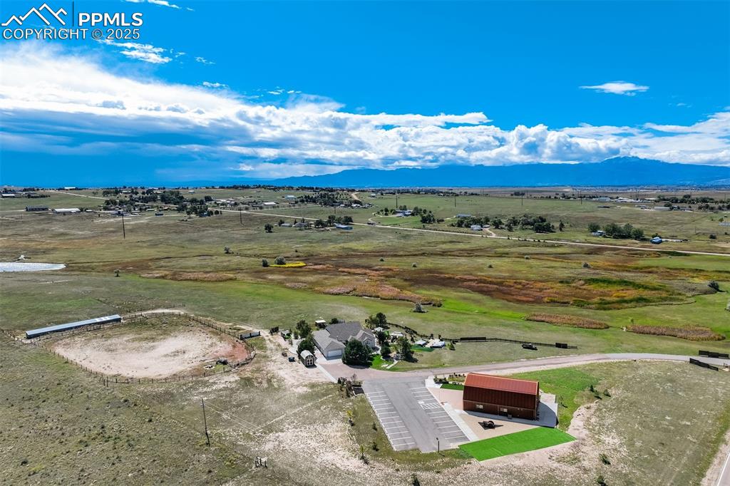 Image 2 of 50: Overview of rural landscape featuring a mountainous background