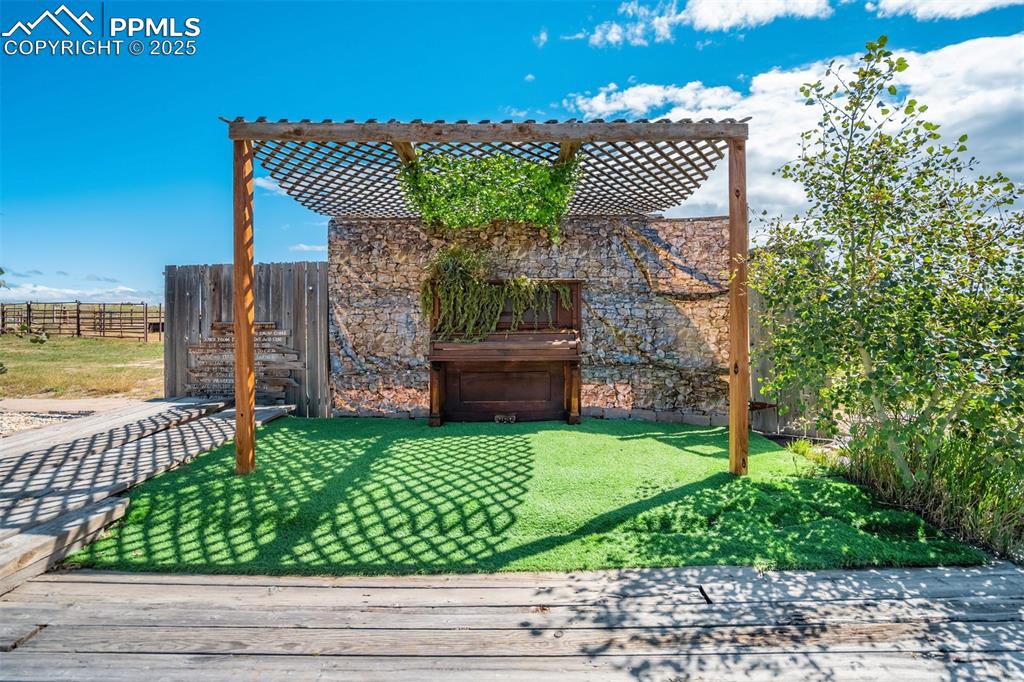 Image 35 of 50: Fenced backyard featuring a deck