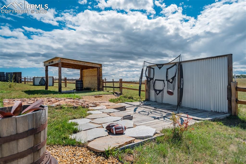 Image 38 of 50: View of yard with an outbuilding and a patio