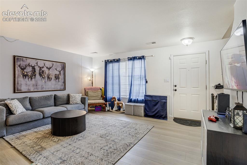 Image 13 of 43: Light-toned flooring throughout, white interior walls, and an overhead flus