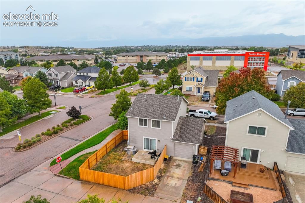 Image 3 of 43: Two-story residence featuring a private backyard, attached garage, and a ne