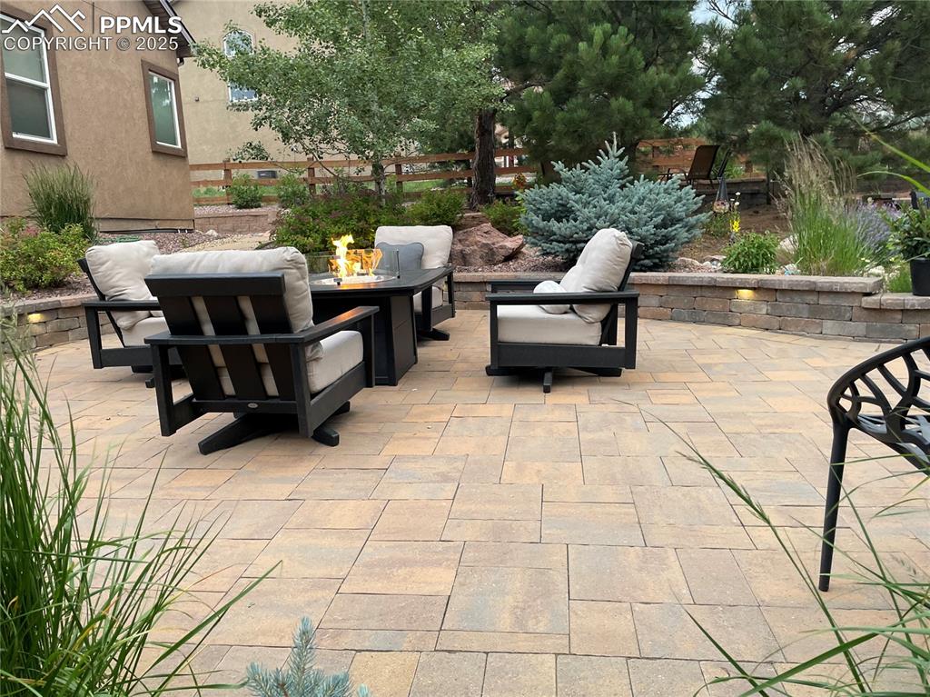 Image 38 of 47: View of patio / terrace featuring a fire pit