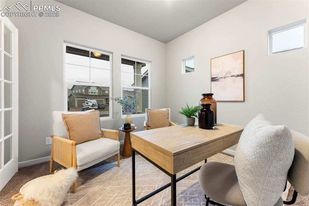 Image 15 of 50: Office space featuring carpet floors and baseboards