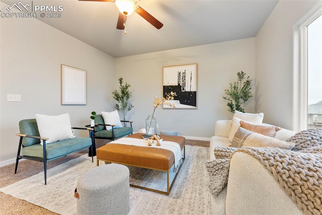 Image 5 of 50: Sitting room featuring carpet flooring, ceiling fan, and plenty of natural 
