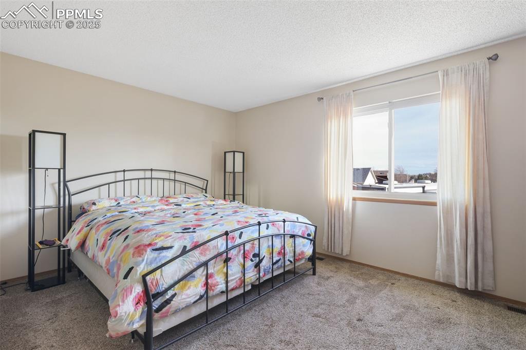 Image 15 of 31: View 2 of upper level primary bedroom.